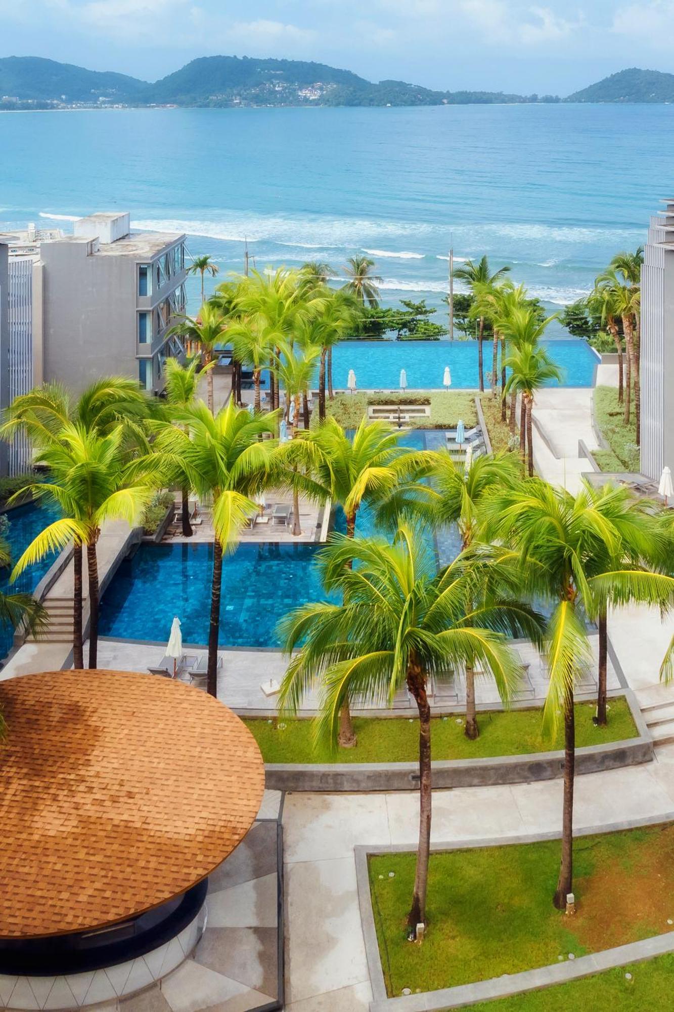 Oceanfront Beach Resort - Sha Extra Plus Patong Exterior foto The swimming pool at the resort